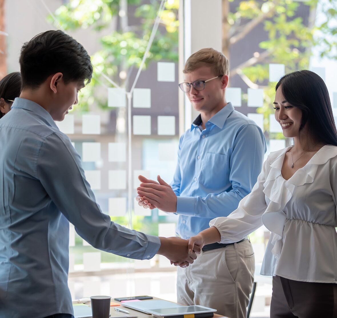 Business owner shaking hands with a marketing strategist